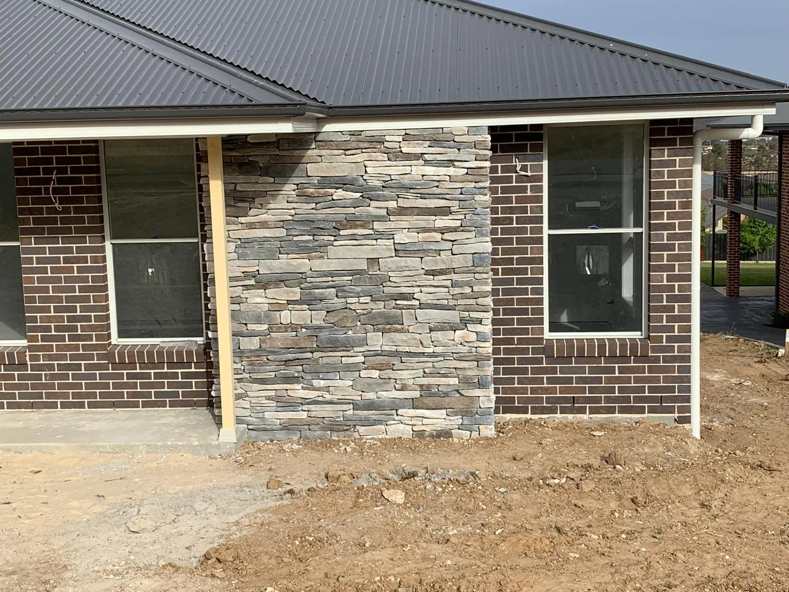 Contemporary brick and stone home exterior